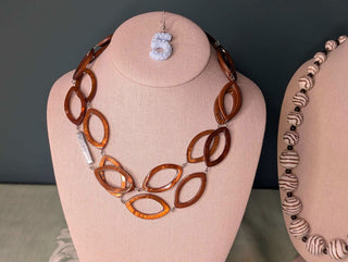 Amber Lucite Petal Shaped Necklace with a silver metal accent - Artful Accumulator Boutique Vintage