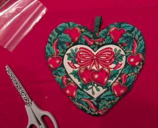 Christmas Heart-shaped Pot Holder with bow, berries, hearts, and holly