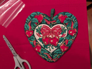 Christmas Heart-shaped Pot Holder with bow, berries, hearts, and holly
