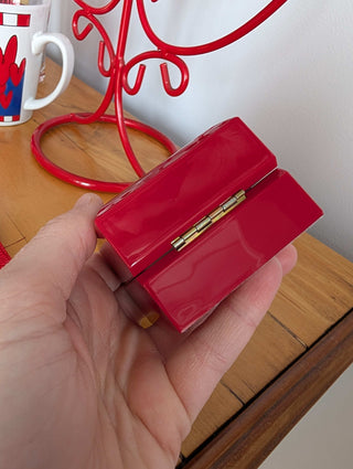 Red Ring Box made with hard plastic, metal hinge, clamshell style