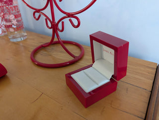 Red Ring Box made with hard plastic, metal hinge, clamshell style
