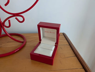 Red Ring Box made with hard plastic, metal hinge, clamshell style