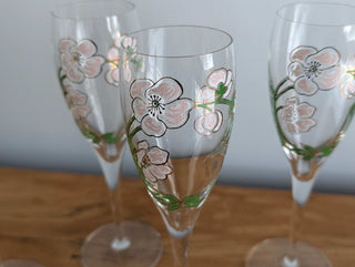 Crystal champagne stemware with soft pink florals, light green leaves, and gold lustre, set of 5