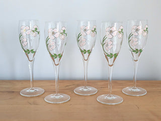 Crystal champagne stemware with soft pink florals, light green leaves, and gold lustre, set of 5