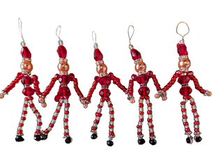 Five red and gold beaded Christmas ornaments on a green holly background
