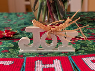 small JOY! banner with straw bow and ivory enamel