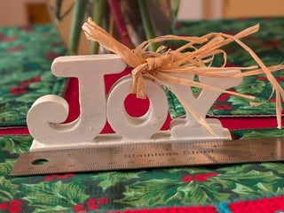 small JOY! banner with straw bow and ivory enamel