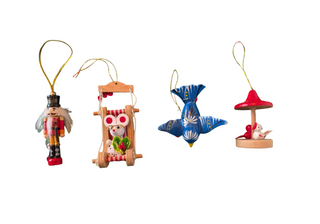 Set of four colorful wooden Christmas ornaments on a white background