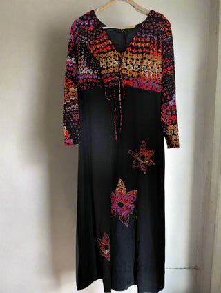 long vintage autumnal dress with multicolour top in warm colours with a black maxi skirt