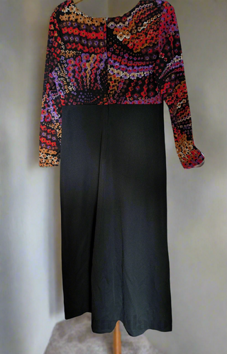 long vintage autumnal dress with multicolour top in warm colours with a black maxi skirt