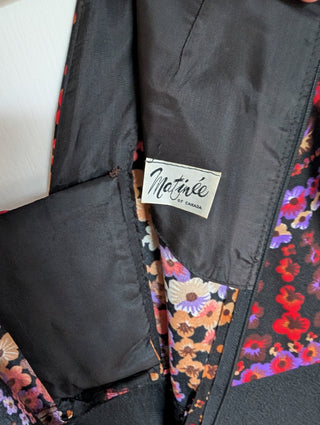 long vintage autumnal dress with multicolour top in warm colours with a black maxi skirt