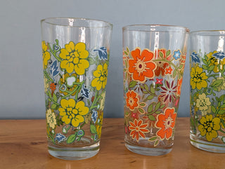 Trio of medium-sized tumblers with orange and green floral patterns - Artful Accumulator Boutique Vintage