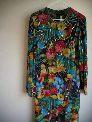 Multicolour sequin layered dress with sheer fabric, bright florals, and a beaded neackline