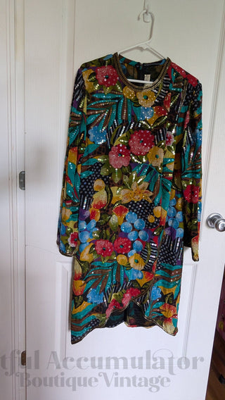 Multicolour sequin layered dress with sheer fabric, bright florals, and a beaded neackline