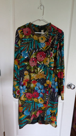 Multicolour sequin layered dress with sheer fabric, bright florals, and a beaded neackline
