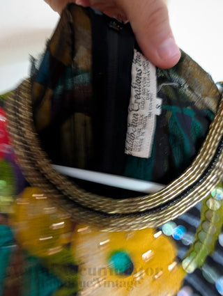 Multicolour sequin layered dress with sheer fabric, bright florals, and a beaded neackline
