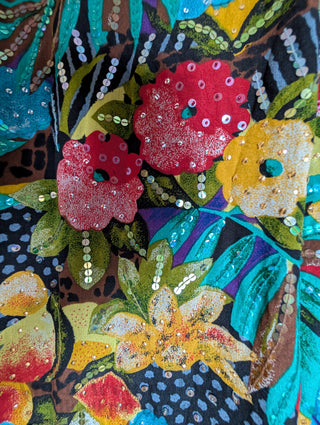 Multicolour sequin layered dress with sheer fabric, bright florals, and a beaded neackline
