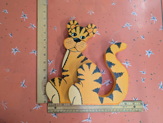 adorable orange cartoon tiger with black stripes on wood, signed on the back