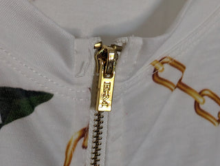 Modern * white zip up cardigan with imagery of jewels, gold chains, and yellow birds