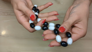 Alternating Black & White oval beads with gold beads between
