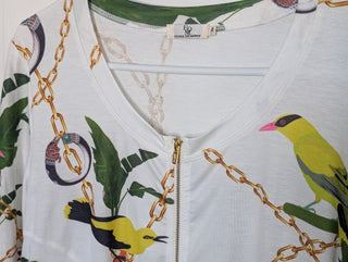 Modern * white zip up cardigan with imagery of jewels, gold chains, and yellow birds