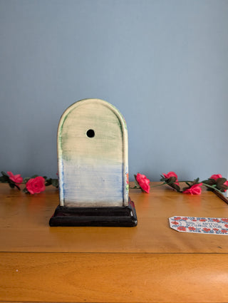 Horloge en céramique, en forme d'arche, images florales avec un effet 3D subtil